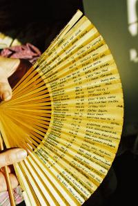 Paper fan with dates written on it by Alfred Challess